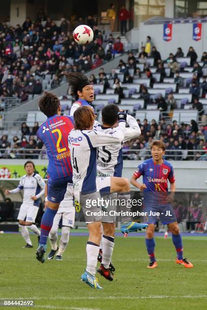 Yojiro Takahagi and Sei Muroya of FC Tokyo competes against Yasuyuki Konno and Hiroki Fujiharu of Gamba Osaka during the J.League J1 match between FC...