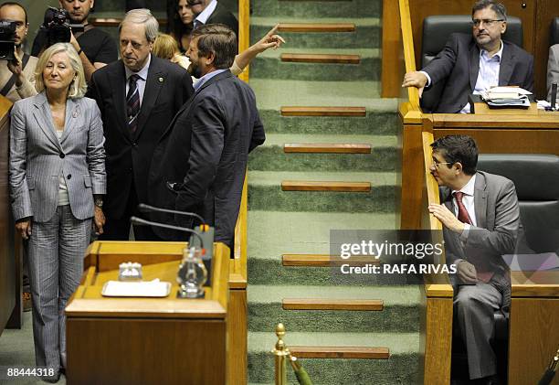 Basque regional president Patxi Lopez looks at the newly elected members of the Spanish Senate, Juana Iturmendi , Joseba Zubia and Roberto Lertxundi...