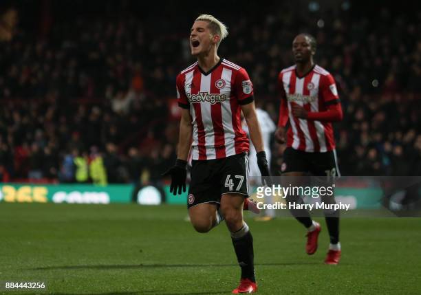 Sergi Canos of Brentford celebrates scoring his sides first goal during the Sky Bet Championship match between Brentford and Fulham at Griffin Park...