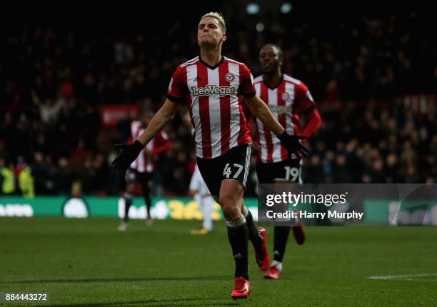 Sergi Canos of Brentford celebrates scoring his sides first goal during the Sky Bet Championship match between Brentford and Fulham at Griffin Park...
