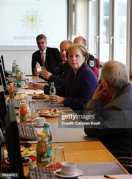 German Chancellor Angela Merkel and German Interior Minister Wolfgang Schaeuble visit the headqarter of the federal police on June 12, 2009 in...