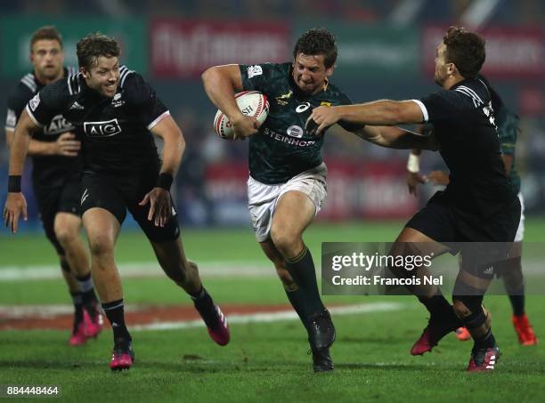 Kwagga Smith of South Africa runs with the ball during the Cup Final match between South Africa and New Zealand on Day Three of the Emirates Dubai...