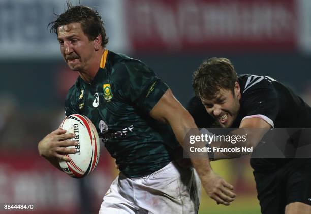 Kwagga Smith of South Africa runs with the ball during the Cup Final match between South Africa and New Zealand on Day Three of the Emirates Dubai...