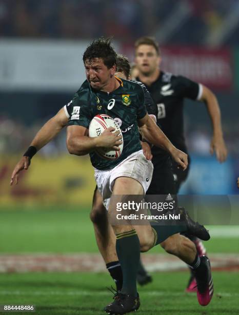 Kwagga Smith of South Africa runs with the ball during the Cup Final match between South Africa and New Zealand on Day Three of the Emirates Dubai...
