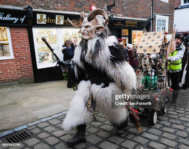 Participants take part in the Whitby Krampus parade on December 2, 2017 in Whitby, England. The Krampus is a horned, anthropomorphic figure from...