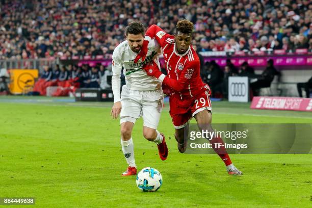 Julian Korb of Hannover and Kingsley Coman of Bayern Muenchen battle for the ball during the Bundesliga match between FC Bayern Muenchen and Hannover...