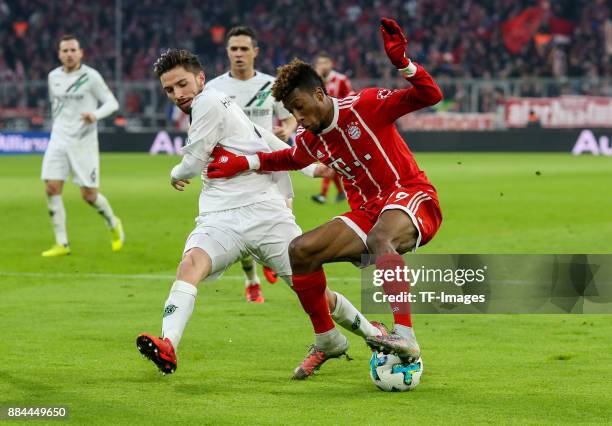 Julian Korb of Hannover and Kingsley Coman of Bayern Muenchen battle for the ball during the Bundesliga match between FC Bayern Muenchen and Hannover...