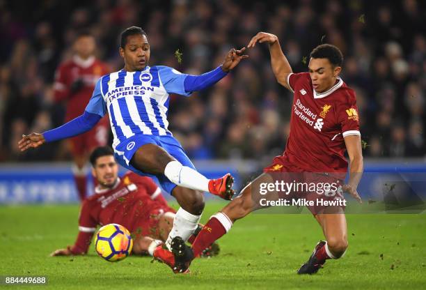 Jose Izquierdo of Brighton and Hove Albion shoots as Trent Alex Arnold of Liverpool attempts to block during the Premier League match between...