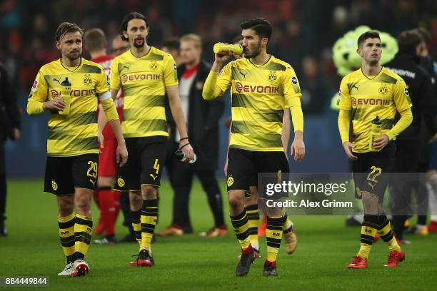 Marcel Schmelzer of Dortmund, Neven Subotic of Dortmund, Nuri Sahin of Dortmund and Christian Pulisic of Dortmund walk off the pitch after the...