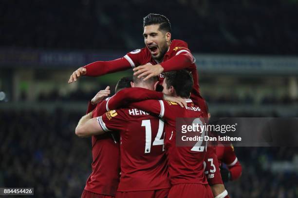 Emre Can of Liverpool celebrates his sides fourth goal with Jordan Henderson of Liverpool during the Premier League match between Brighton and Hove...