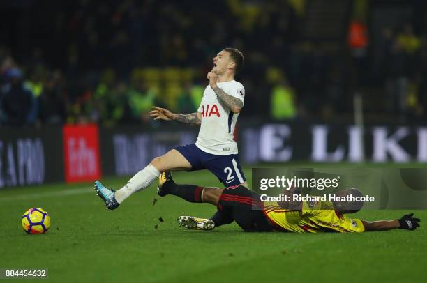 Marvin Zeegelaar of Watford fouls Kieran Trippier of Tottenham Hotspur during the Premier League match between Watford and Tottenham Hotspur at...