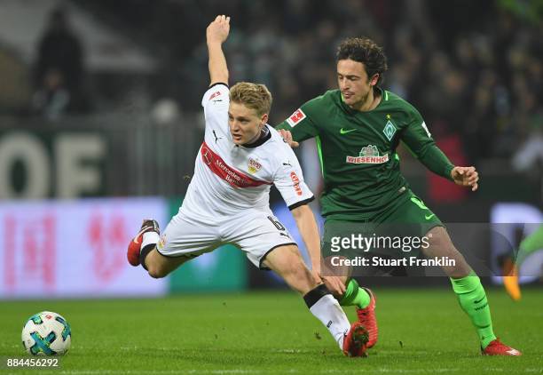 Thomas Delaney of Bremen is challenged by Santiago Ascacibar of Stuttgart during the Bundesliga match between SV Werder Bremen and VfB Stuttgart at...