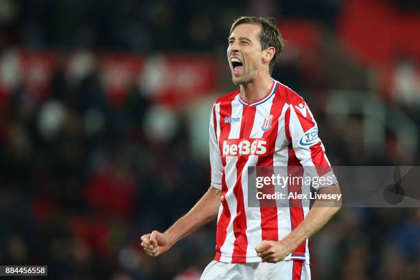 Peter Crouch of Stoke City celebrates victory after the Premier League match between Stoke City and Swansea City at Bet365 Stadium on December 2,...