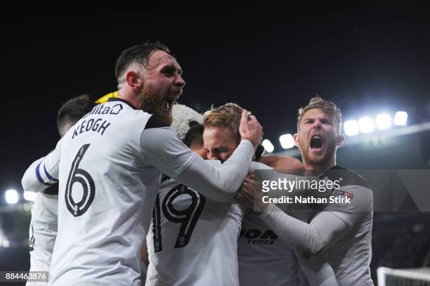 Richard Keogh and Sam Winnall of Derby County celebrates with Johnny Russell after he scores the winning goal during the Sky Bet Championship match...