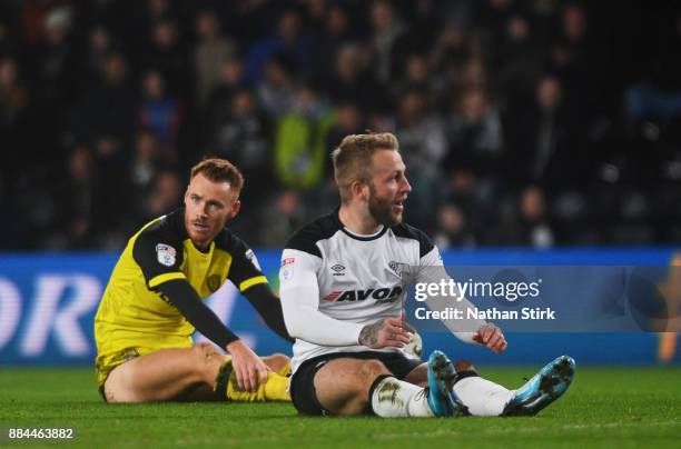 Johnny Russell of Derby County and Tom Naylor of Burton Albion look on during the Sky Bet Championship match between Derby County and Burton Albion...
