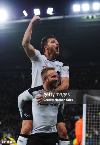 Johnny Russell of Derby County celebrates with Chris Martin after he scores during the Sky Bet Championship match between Derby County and Burton...