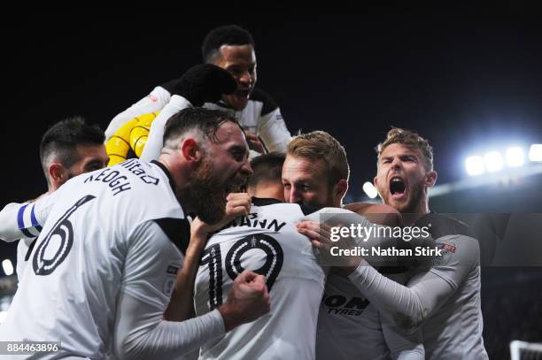 Richard Keogh and Sam Winnall of Derby County celebrates with Johnny Russell after he scores the winning goal during the Sky Bet Championship match...