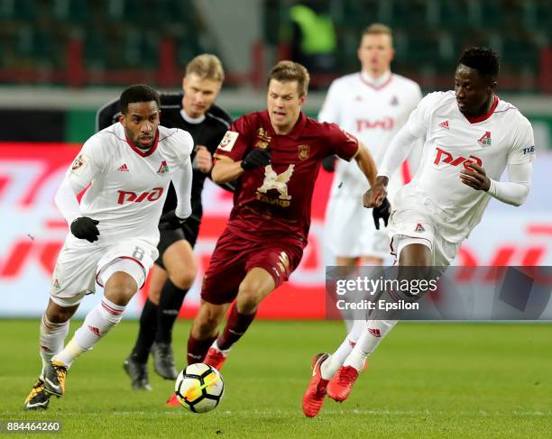 Jefferson Farfan and Eder of FC Lokomotiv Moscow vies for the ball with Maksim Kanunnikov of FC Rubin Kazan during the Russian Premier League match...