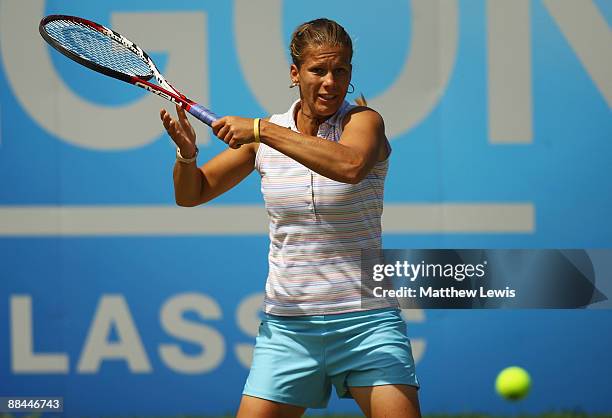 Melinda Czink of Hungary in action against Sania Mirza of India during day five of the AEGON Classic at the Edgbaston Priory Club on June 12, 2009 in...