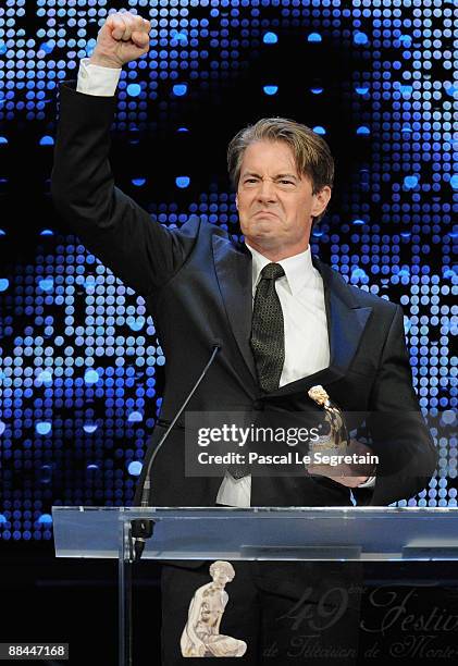 Actor Kyle Maclachlan gestures as he receives a Golden Nymph for best Comedy TV Series during the 2009 Monte Carlo Television Festival held at...