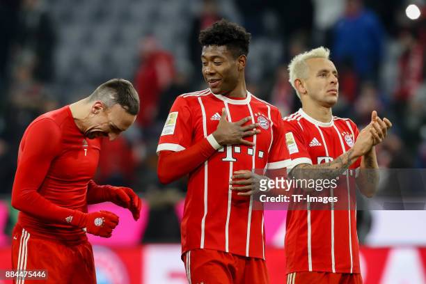 Franck Ribery of Bayern Muenchen, David Alaba of Bayern Muenchen and Rafinha of Bayern Muenchen celebrate after winning the Bundesliga match between...