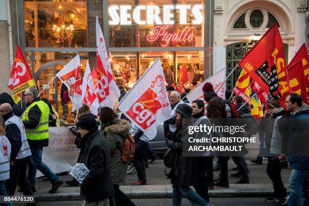People walks past a sex shop in the Pigalle district of Paris during a demonstration against unemployment and precarious work on December 2, 2017 in...
