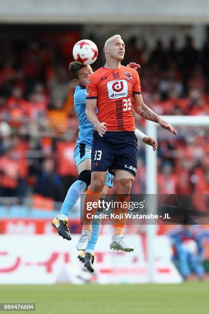 Marcelo of Omiya Ardija and Tatsuki Nara of Kawasaki Frontale compete for the ball during the J.League J1 match between Kawasaki Frontale and Omiya...