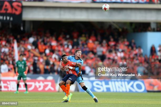 Mateus of Omiya Ardija and Tatsuki Nara of Kawasaki Frontale compete for the ball during the J.League J1 match between Kawasaki Frontale and Omiya...