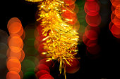 blurry Christmas background, abstract boked effect, with golden shiny bow