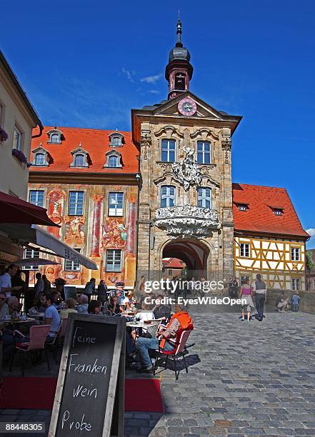 Cafe in front of the former City Hall at the river Regnitz with its facade in rococo style on June 11, 2009 in Bamberg, Germany. Bamberg is listed as...