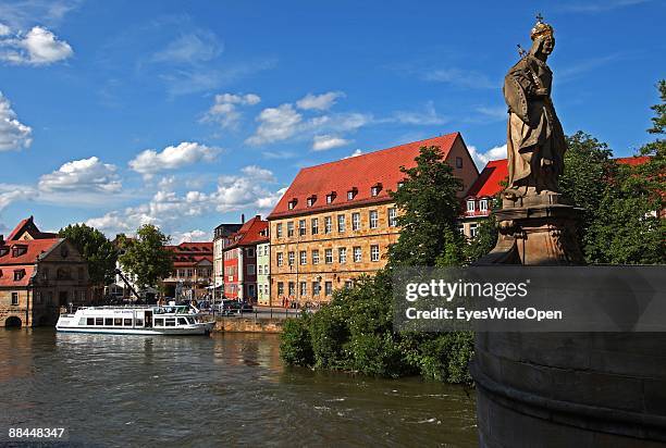 Tourist boat on the river Regnitz on June 11, 2009 in Bamberg, Germany. Bamberg is listed as a World Heritage by UNESCO.