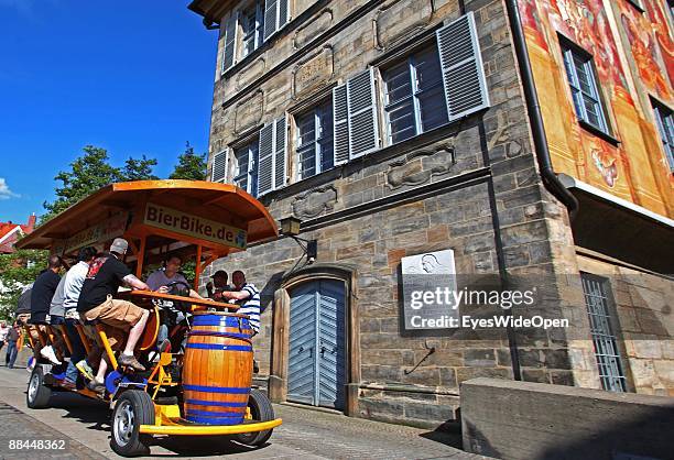 Beerbike at the former City Hall at the river Regnitz with its facade in rococo style on June 11, 2009 in Bamberg, Germany. Bamberg is listed as a...