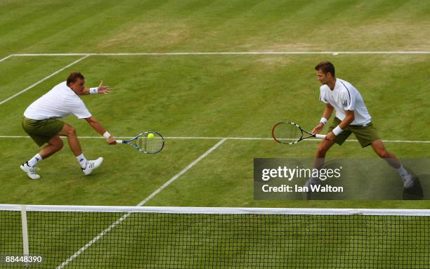 Mariusz Fyrstenberg of Poland playing with Marcin Matkowski of Poland during the men's doubles quarter final match against Jordan Kerr of Australia...