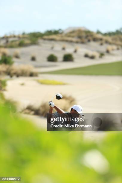 Tiger Woods of the United States plays his shot from the first tee during the third round of the Hero World Challenge at Albany, Bahamas on December...