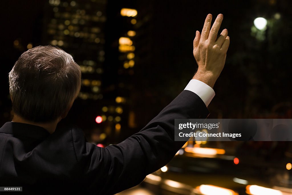 Businessman hailing a cab