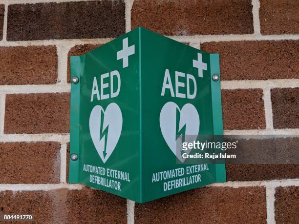 aed device in sports ground - defibrillation stock pictures, royalty-free photos & images