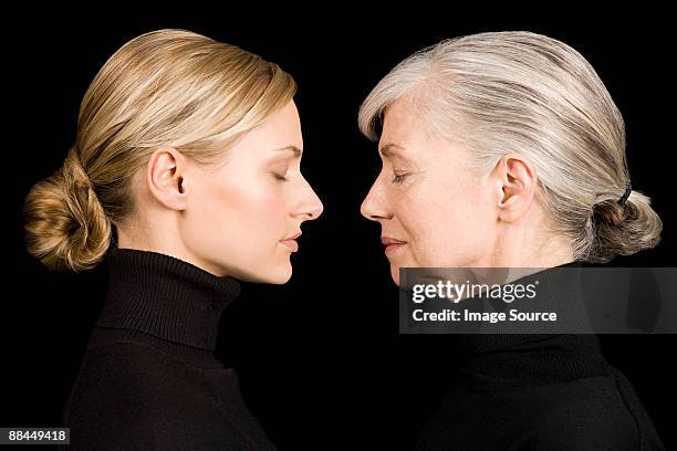 young and senior women face to face - young at heart bildbanksfoton och bilder