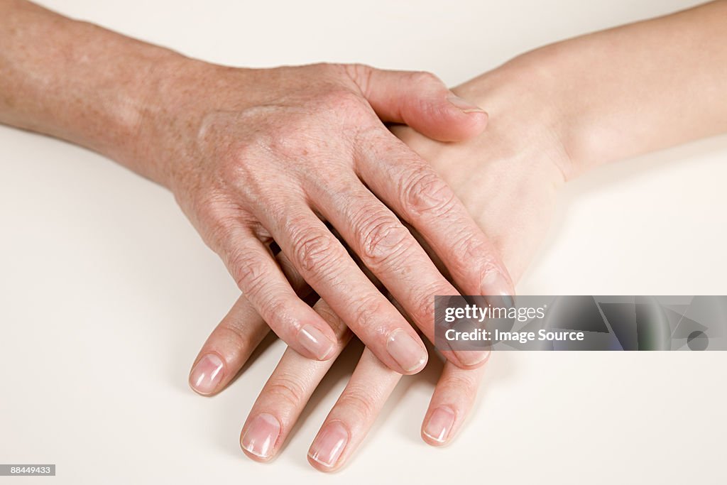 Hands on young and older women