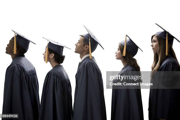 graduates - graduation gown stock pictures, royalty-free photos & images