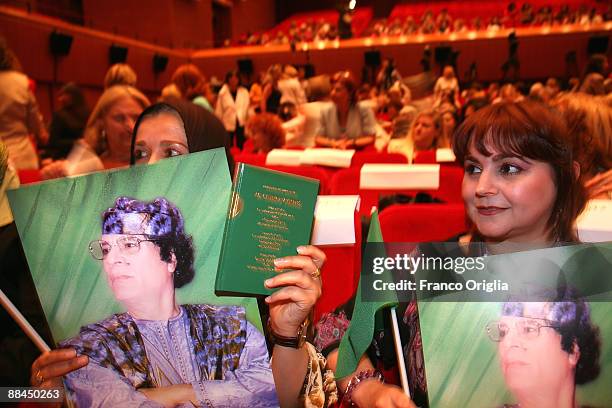 Women attend a meeting with Lybia's Leader Muammar Gaddafi at the Auditorium Parco Della Musica on June 12, 2009 in Rome, Italy. The meeting...