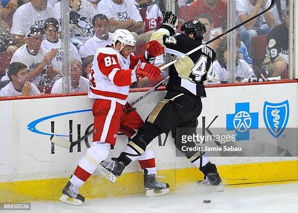 Marian Hossa of the Detroit Red Wings against Brooks Orpik of the Pittsburgh Penguins during Game Six of the NHL Stanley Cup Finals at the Mellon...