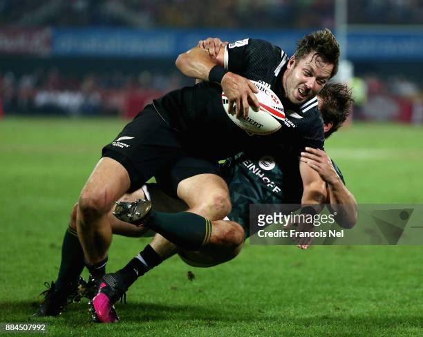 Tim Mikkelson of New Zealand is tackled by Kwagga Smith of South Africa during the Cup Final match between South Africa and New Zealand on Day Three...