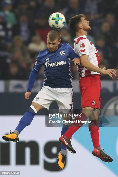 Maximilian Meyer of Schalke fights for the ball with Salih Oezcan of Koeln during the Bundesliga match between FC Schalke 04 and 1. FC Koeln at...