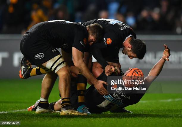 Kearnan Myall of Wasps celebrates scoring the winning try with Willie Le Roux and Jack Willis of Wasps during the Aviva Premiership match between...
