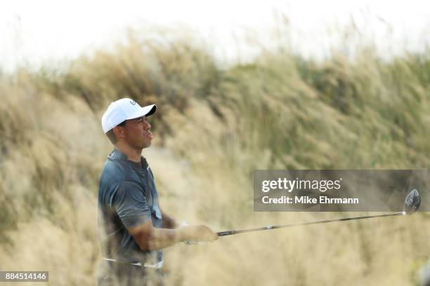 Tiger Woods of the United States plays his shot from the third tee during the third round of the Hero World Challenge at Albany, Bahamas on December...