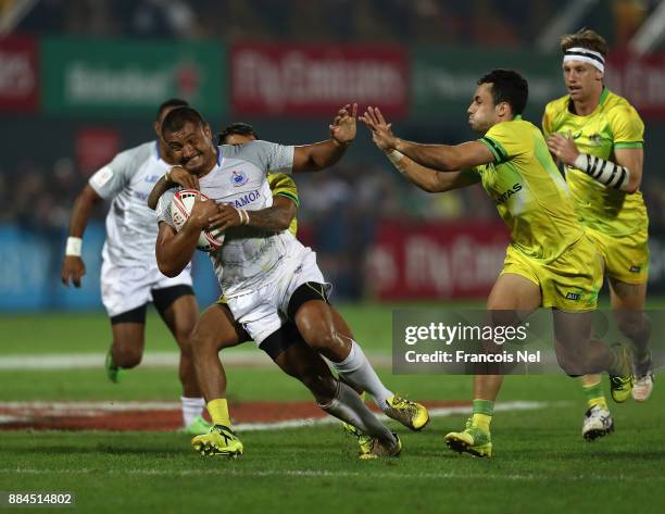 Alamanda Motuga of Samoa is tacled by Maurice Longbottom of Australia during the match between Australia and Samoa on Day Three of the Emirates Dubai...