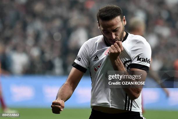 Besiktas' Turkish forward Cenk Tosun celebrates after scoring a goal during the Turkish Super Lig football match between Besiktas and Galatasaray on...