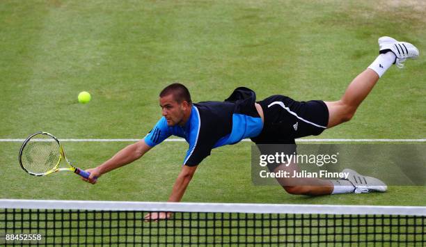 Mikhail Youzhny of Russia dives for a forehand during the men's quarter final match against James Blake of USA during Day 5 of the the AEGON...