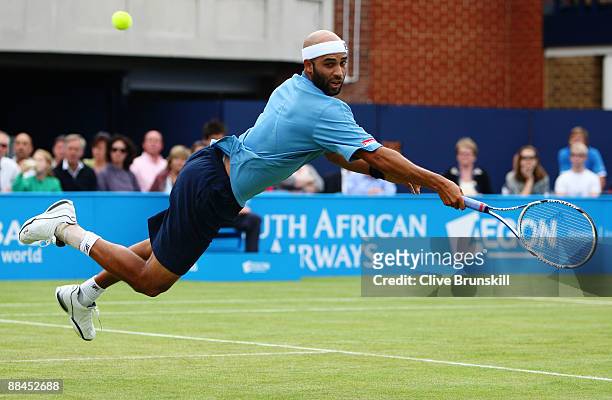 James Blake of USA dives for a backhand during the men's quarter final match against Mikhail Youzhny of Russia during Day 5 of the the AEGON...