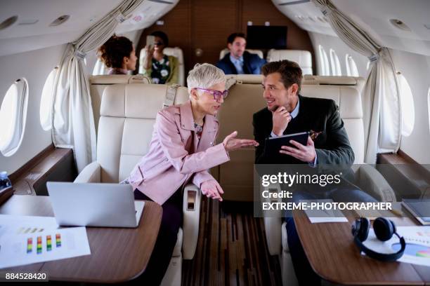 people inside private airplane - first class imagens e fotografias de stock